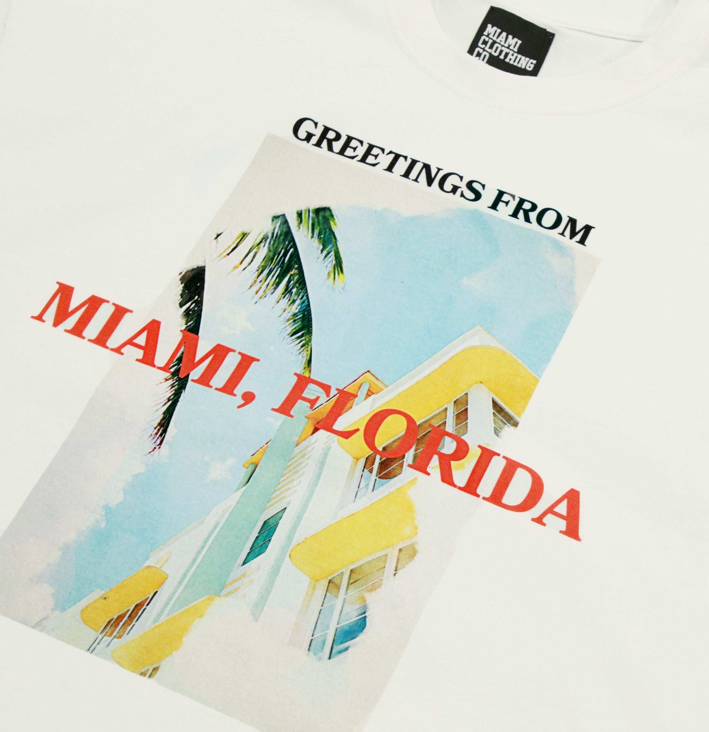 Sleeveless cutoff T-shirt with Miami graphic and "Greetings from Miami, Florida" text, made from 100% cotton. Miami t-shirt