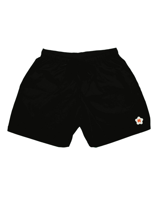 Black nylon shorts with rubber Miami Clothing Co. logo, elastic waistband, front welt pockets, and drawstrings.