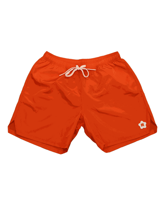 Orange nylon shorts with rubber Miami Clothing Co. logo, elastic waistband, front welt pockets, and drawstrings.